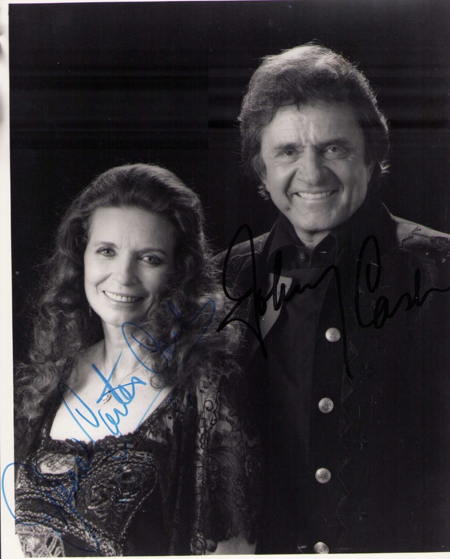 Johnny and June Cash signed photograph: A vintage signed portrait by both Johnny Cash and June Carter Cash none better ! Certificate of AuthenticityEVERY item in this auction comes with at minimum one fully illustrated and serial numbered C