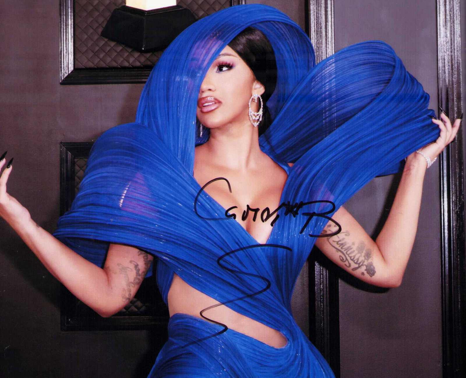 Cardi B signed photograph: A scarce in person signed 8x10 of the new pop sensation Certificate of AuthenticityEVERY item in this auction comes with at minimum one fully illustrated and serial numbered COA signed by the leading 