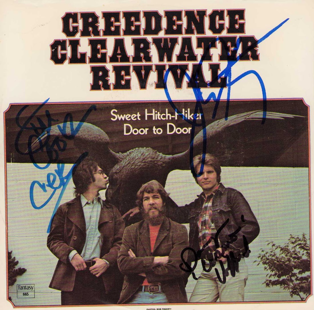 CCR signed record and sleeve: A CCR band signed 45rpm record and sleeve by Fogerty Cook and Clifford Certificate of AuthenticityEVERY item in this auction comes with at minimum one fully illustrated and serial numbered COA signed 