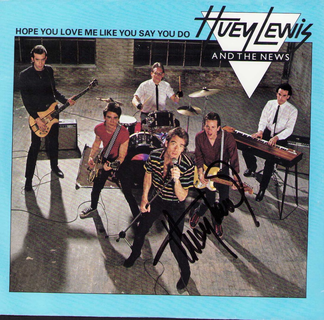 Huey Lewis signed 45rpm record and sleeve: A Huey Lewis signed 45rpm record sleeve and record signed Certificate of AuthenticityEVERY item in this auction comes with at minimum one fully illustrated and serial numbered COA signed by the leadin