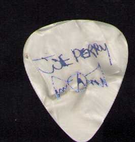 Joe Perry stage used guitar pick: A Joe Perry of Aerosmith vintage stage used guitar pick obtained from famed roadie Certificate of AuthenticityEVERY item in this auction comes with at minimum one fully illustrated and serial numbered