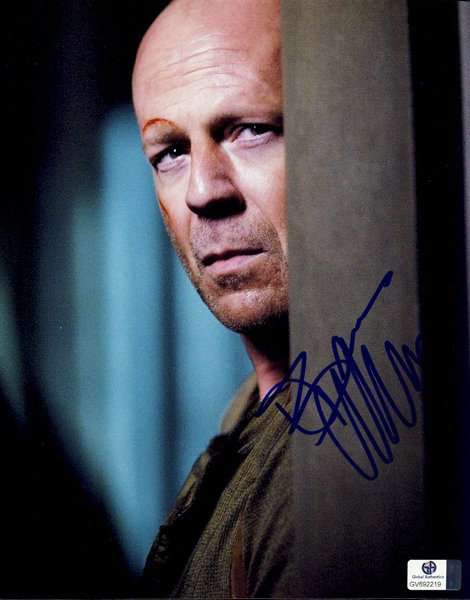 Bruce Willis "Die Hard" Signed 8x10 Photograph: This is an 8x10 photograph signed by "Die Hard" star Bruce Willis. The unusual shot was signed in person. He is an uncommon signature and is not a friendly signer. This photo is certified by Global Au