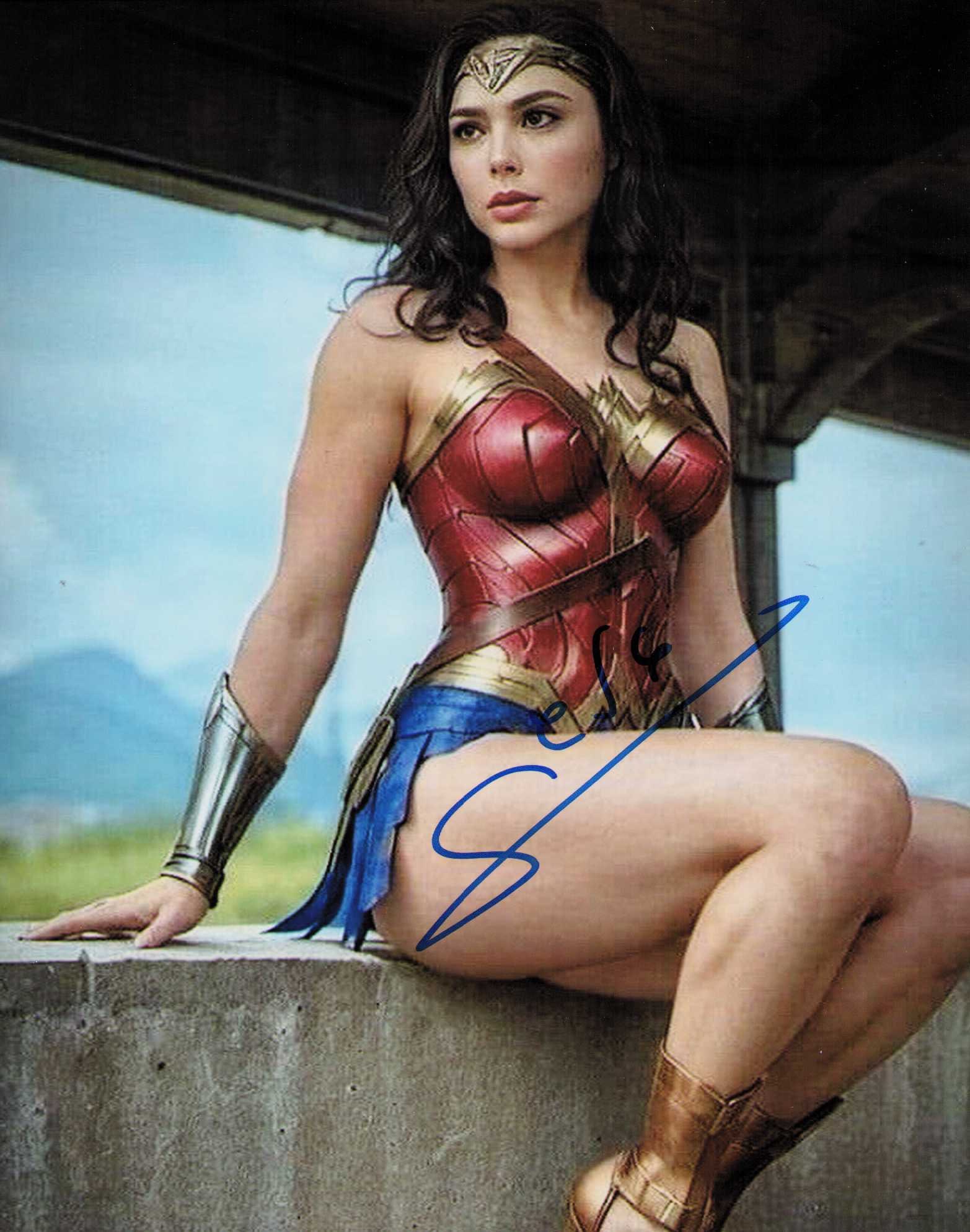 Gal Gadot Wonder Woman signed photograph: Sexy Wonder Woman signed 8x10 by her . Certificate of AuthenticityEVERY item in this auction comes with at minimum one fully illustrated and serial numbered COA signed by the leading authenticator in 