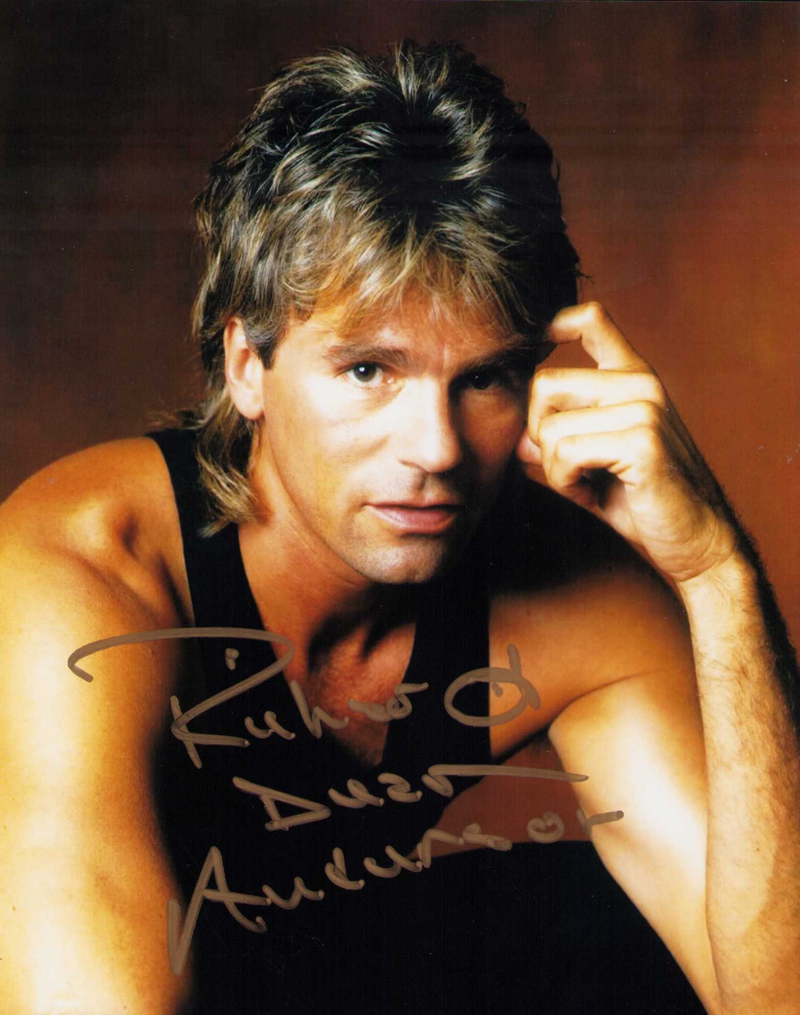 Richard Dean Anderson MacGuyver signed photograph: A nice MacGuyver signed 8x10 by the Stargate star Certificate of AuthenticityEVERY item in this auction comes with at minimum one fully illustrated and serial numbered COA signed by the leading