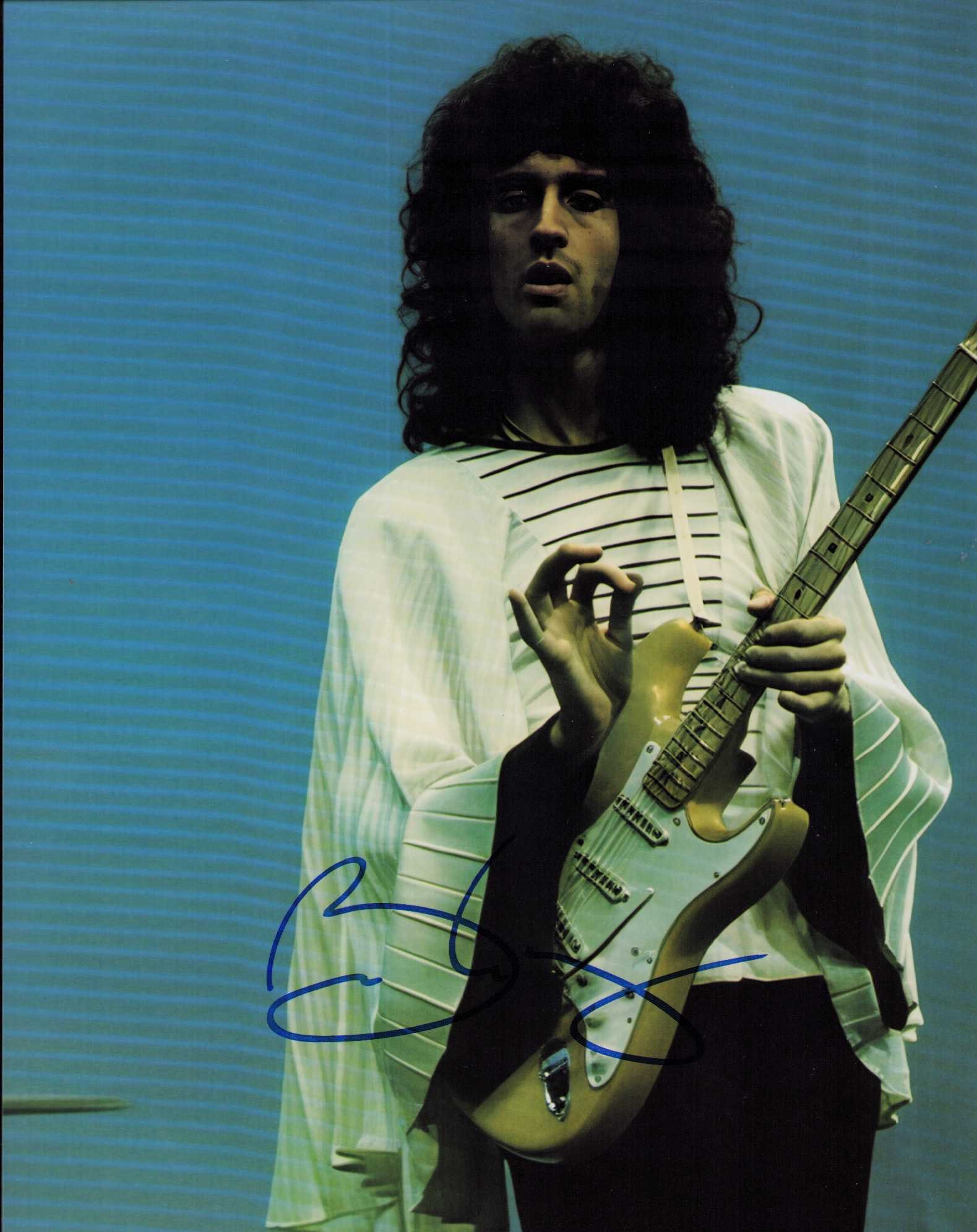 Brian May QUEEN signed photograph: A scarce signed 8x10 of QUEENS leader and lead guitarist Brian May Certificate of AuthenticityEVERY item in this auction comes with at minimum one fully illustrated and serial numbered COA signed by