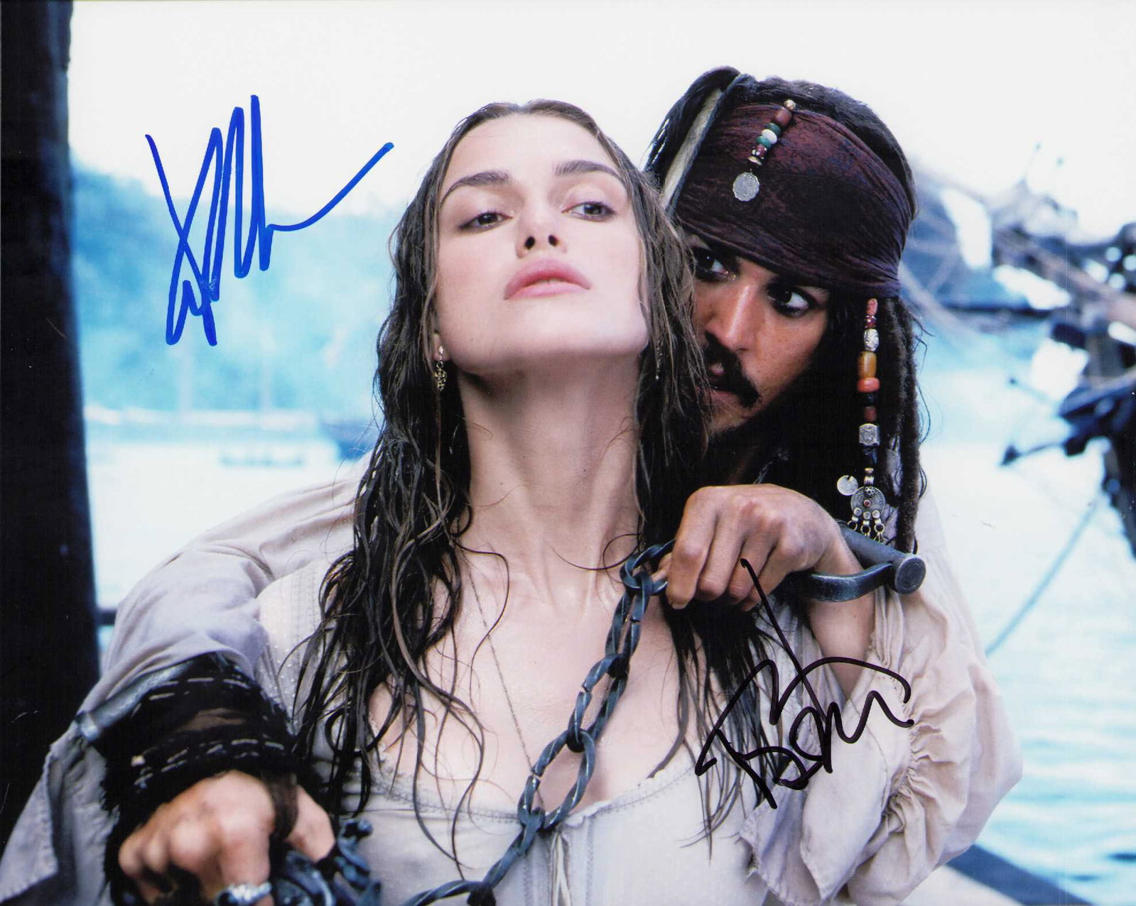 Johnny Depp and Keira Knightley signed photograph: Pirates of the Caribbean signed 8x10 by both stars Johnny Depp and Keira Knightley Certificate of AuthenticityEVERY item in this auction comes with at minimum one fully illustrated and serial