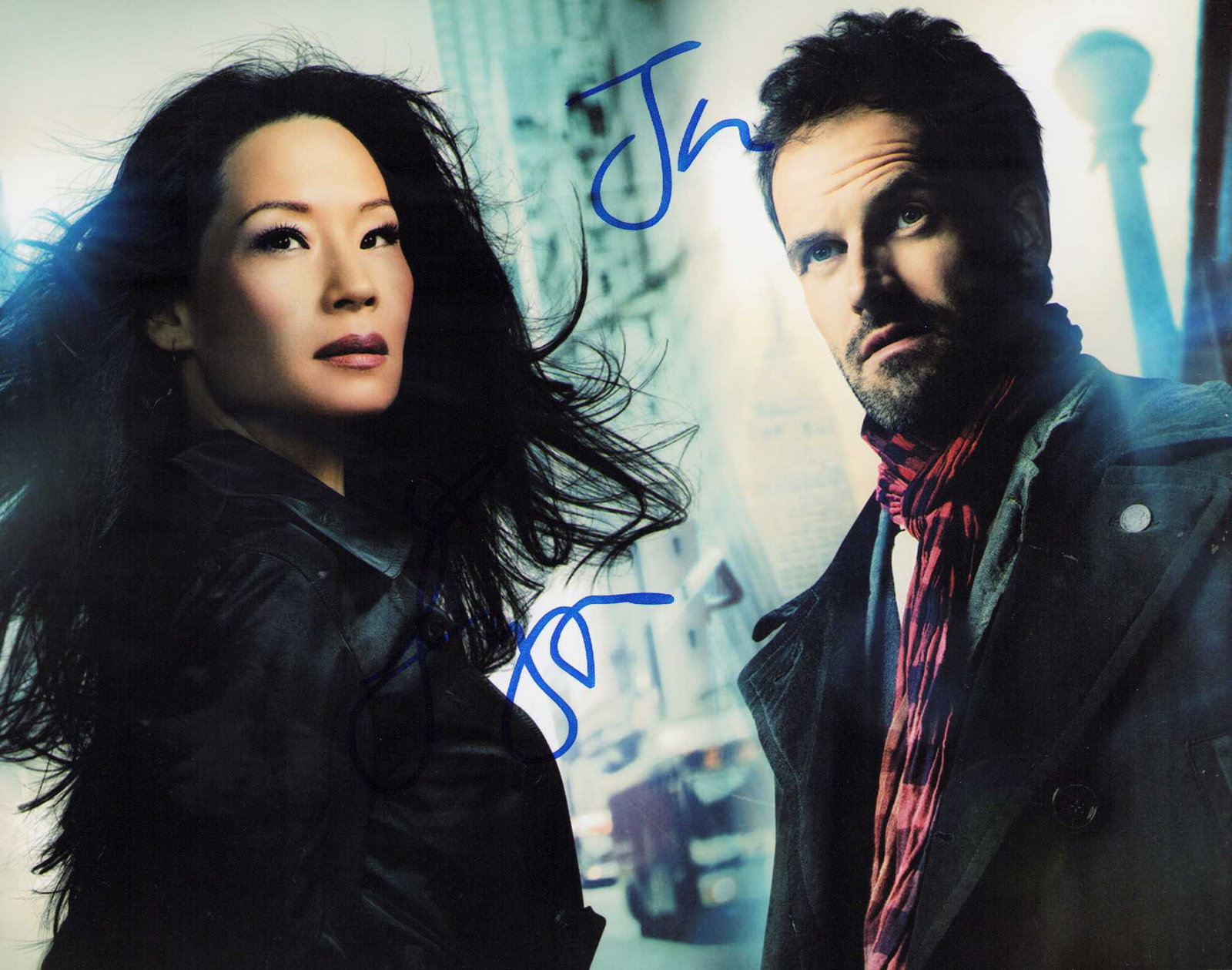 Elementary cast signed by Lucy Liu and Johnny Lee Miller photograph: Elementary Tv series cast signed 8x10 by Johnny Lee Miller and Lucy Liu Certificate of AuthenticityEVERY item in this auction comes with at minimum one fully illustrated and serial numbered COA