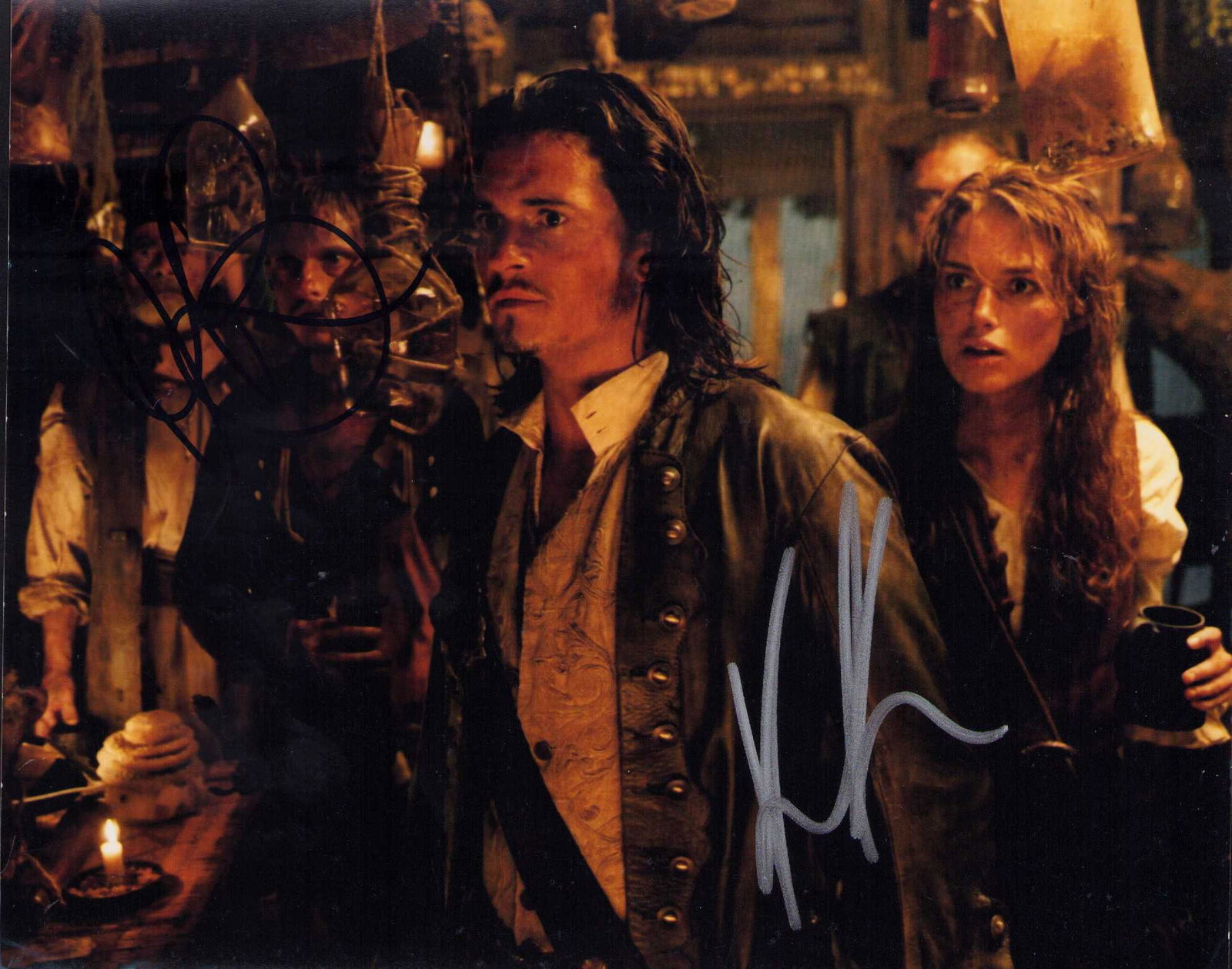 Orlando Bloom and Keira Knightely signed photograph: Pirates of the Caribbean signed by both of Depps costars Orlando Bloom and Keira Knightely Certificate of AuthenticityEVERY item in this auction comes with at minimum one fully illustrated and serial 
