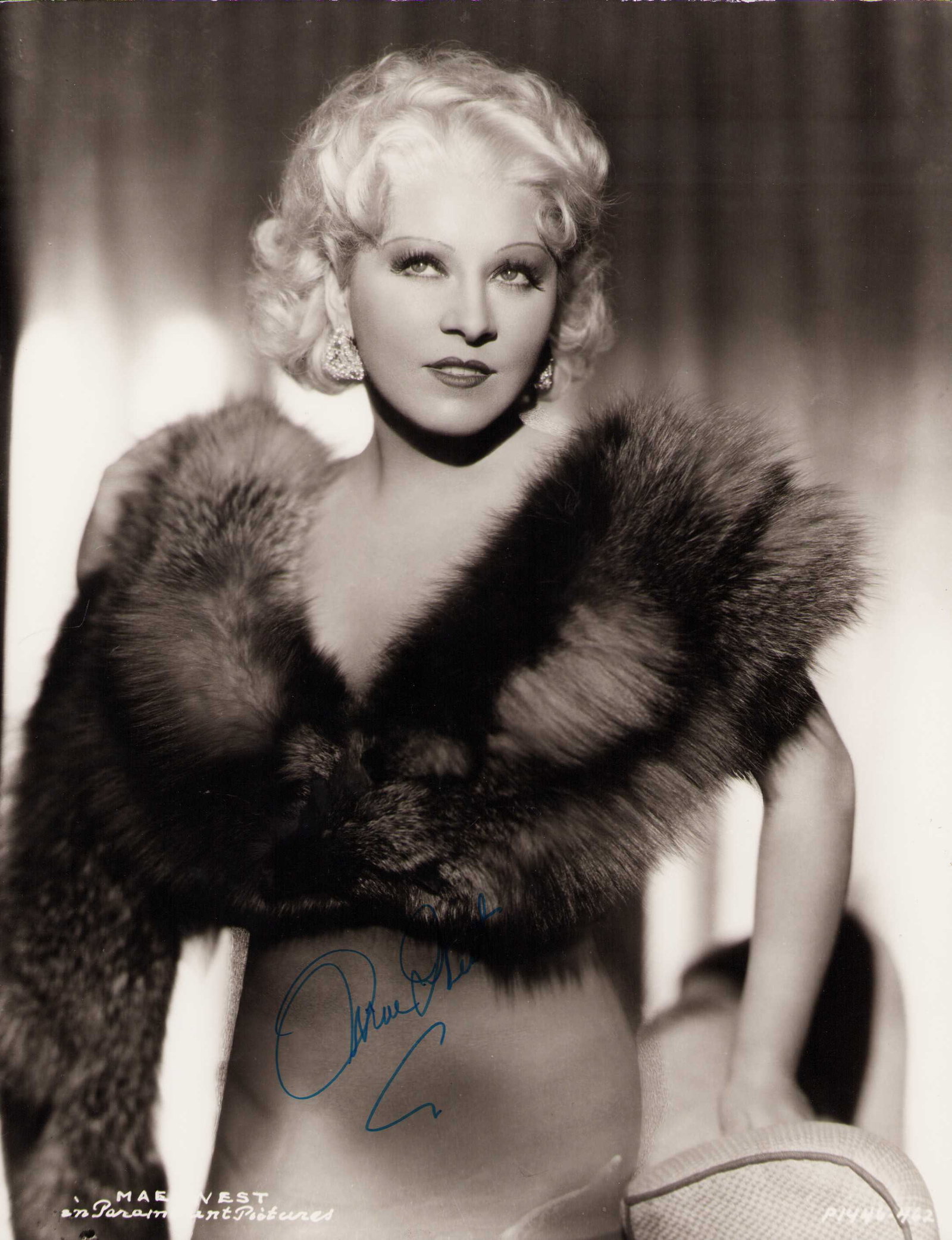 Mae West signed 11x14 photograph: An incredible 11x14 signed Mae West photograph by the famed actress Certificate of AuthenticityEVERY item in this auction comes with at minimum one fully illustrated and serial numbered COA signed by