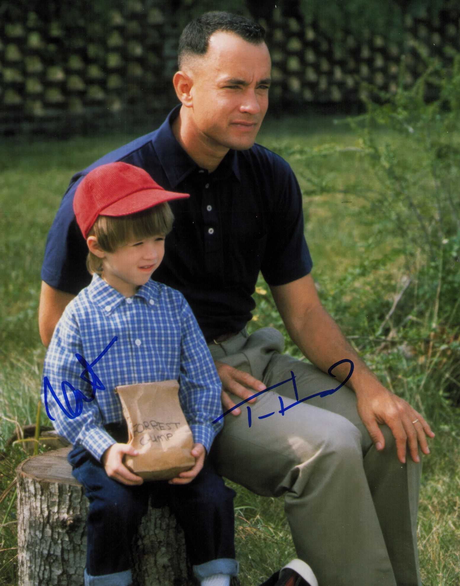 Forrest Gump signed photograph by Tom Hanks and Haley Joel Osment: A Forrest Gump scene still signed by star Tom Hanks and costar Haley Joel Osment Certificate of AuthenticityEVERY item in this auction comes with at minimum one fully illustrated and serial numbered