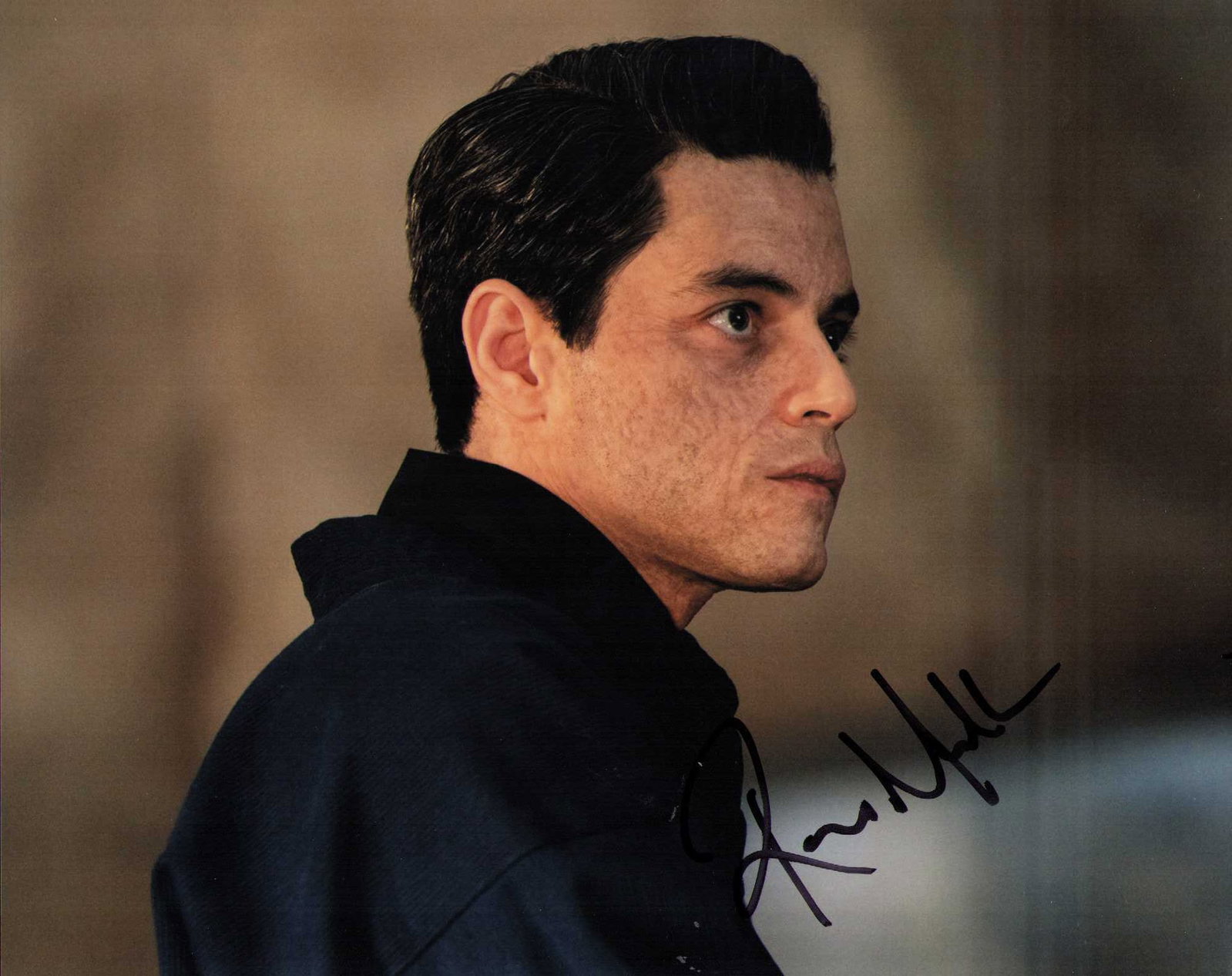 Rami Malek rare signed photograph: RARE in ANYTHING the Queen movie star and Irobot star and even Bond villain star signed 8x10 Certificate of AuthenticityEVERY item in this auction comes with at minimum one fully illustrated and seria