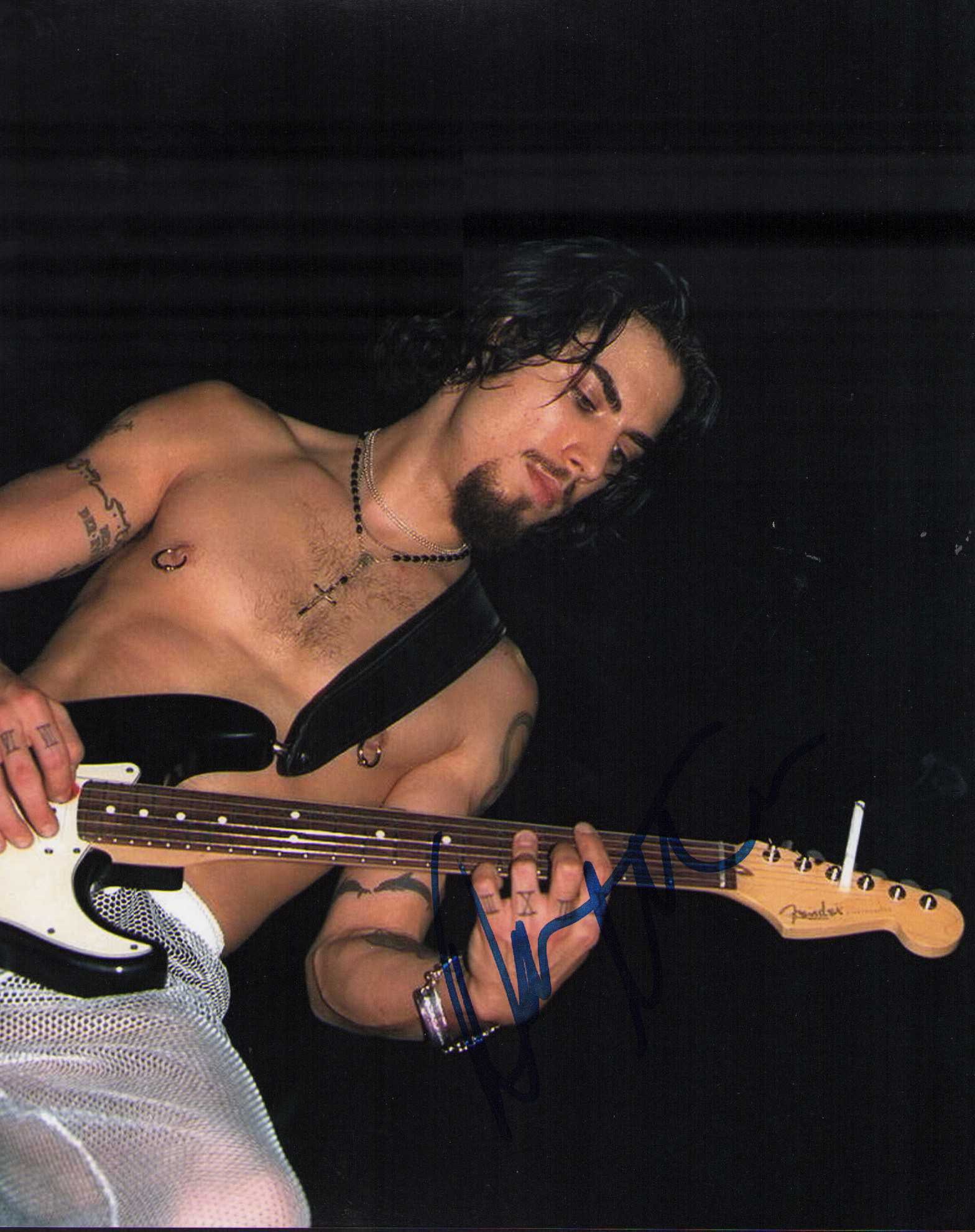Dave Navarro signed photograph: Signe dby the rock legend wailing away on stage Certificate of AuthenticityEVERY item in this auction comes with at minimum one fully illustrated and serial numbered searchable online COA signed by