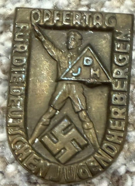 A Day of Sacrifice Relief badge: A German Nazi fundraising badge issued in 1930s for Hitlers Youth