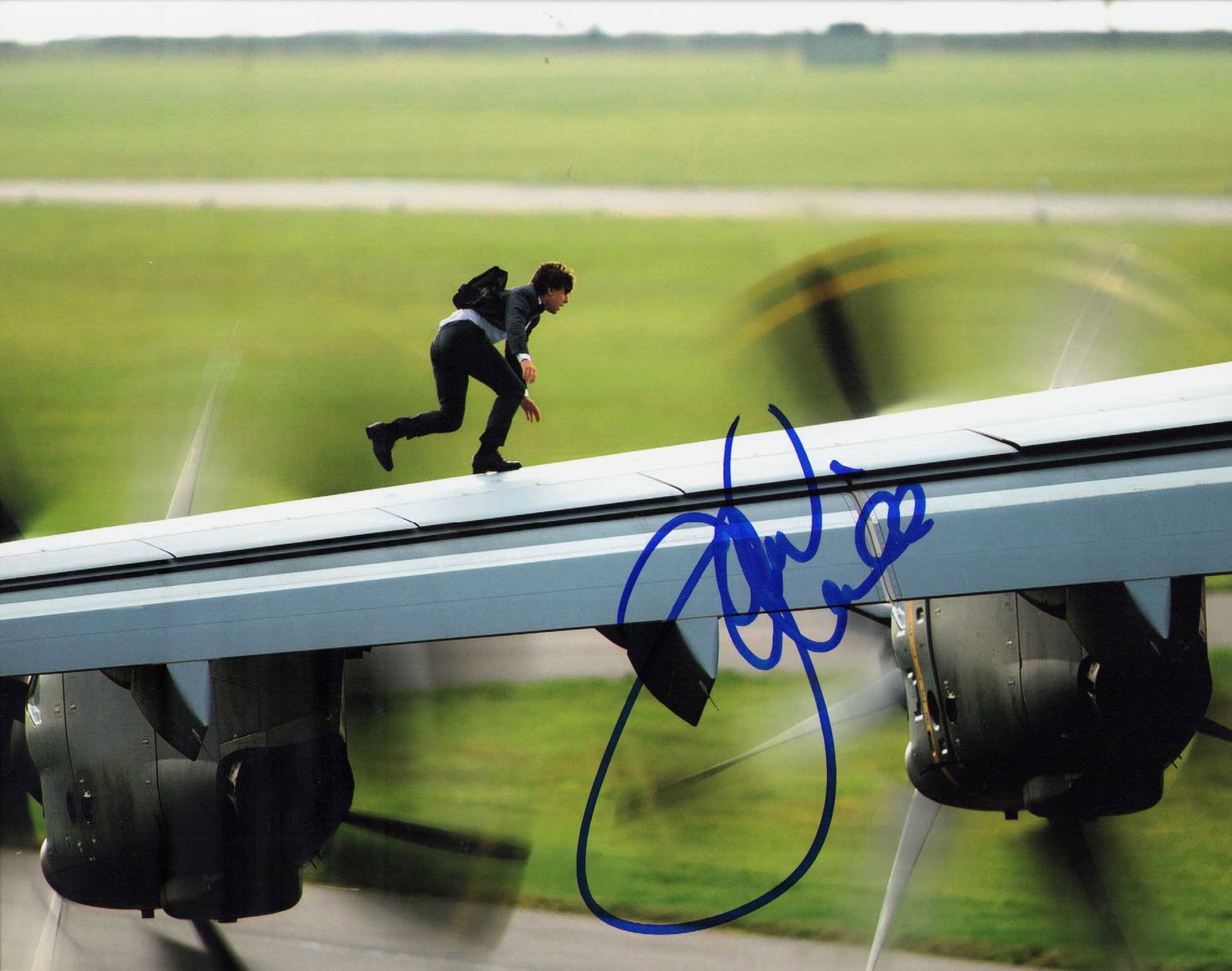 Tom Cruise Mission Impossible signed photograph: A great wing walking shot from a Mission Impossible film by the star signed in person Certificate of AuthenticityEVERY item in this auction comes with at minimum one fully illustrated and serial numbe