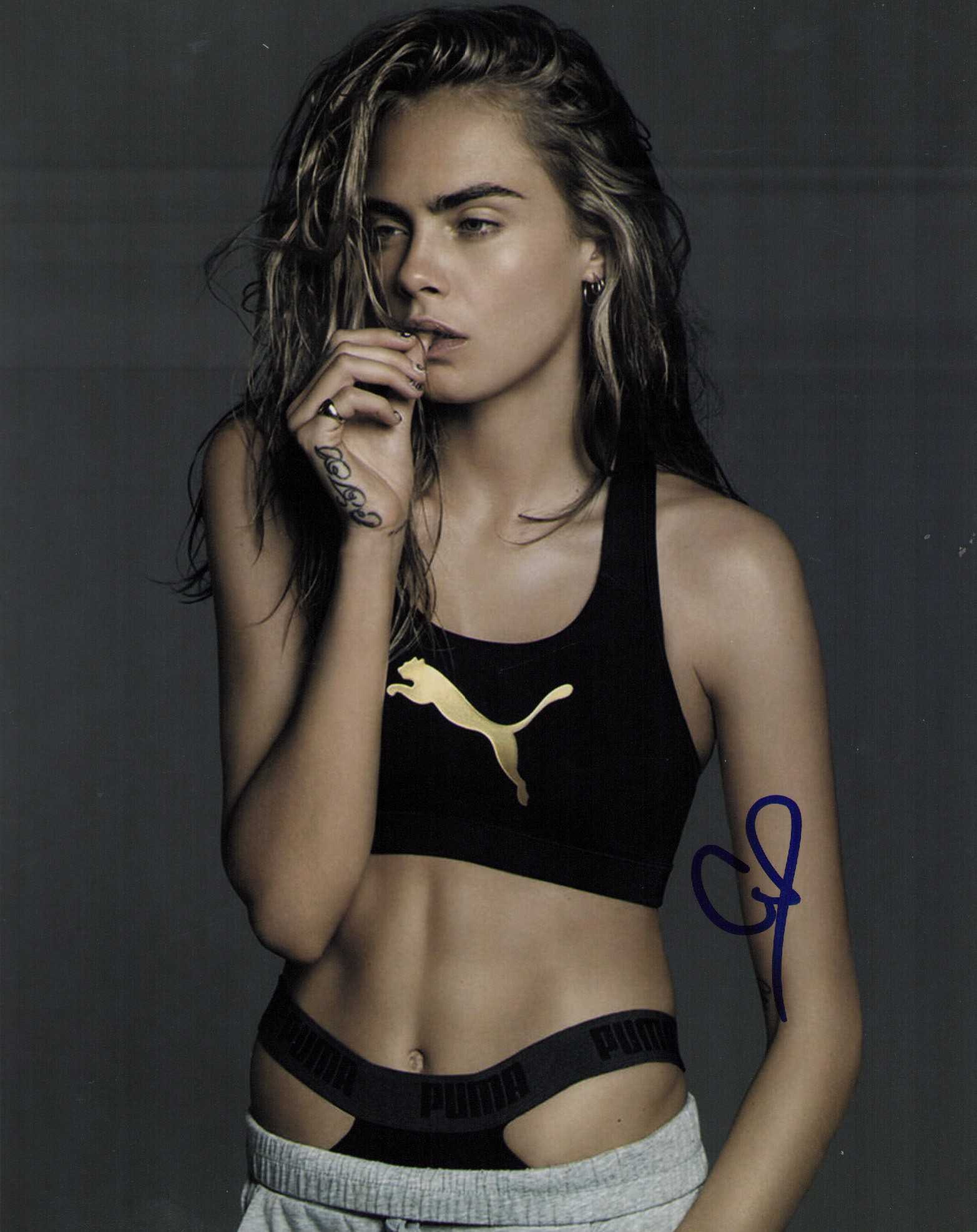 Cara Delavigne signed photograph: A sexy signed 8x10 of the model and actress Certificate of AuthenticityEVERY item in this auction comes with at minimum one fully illustrated and serial numbered searchable online COA signed by the le