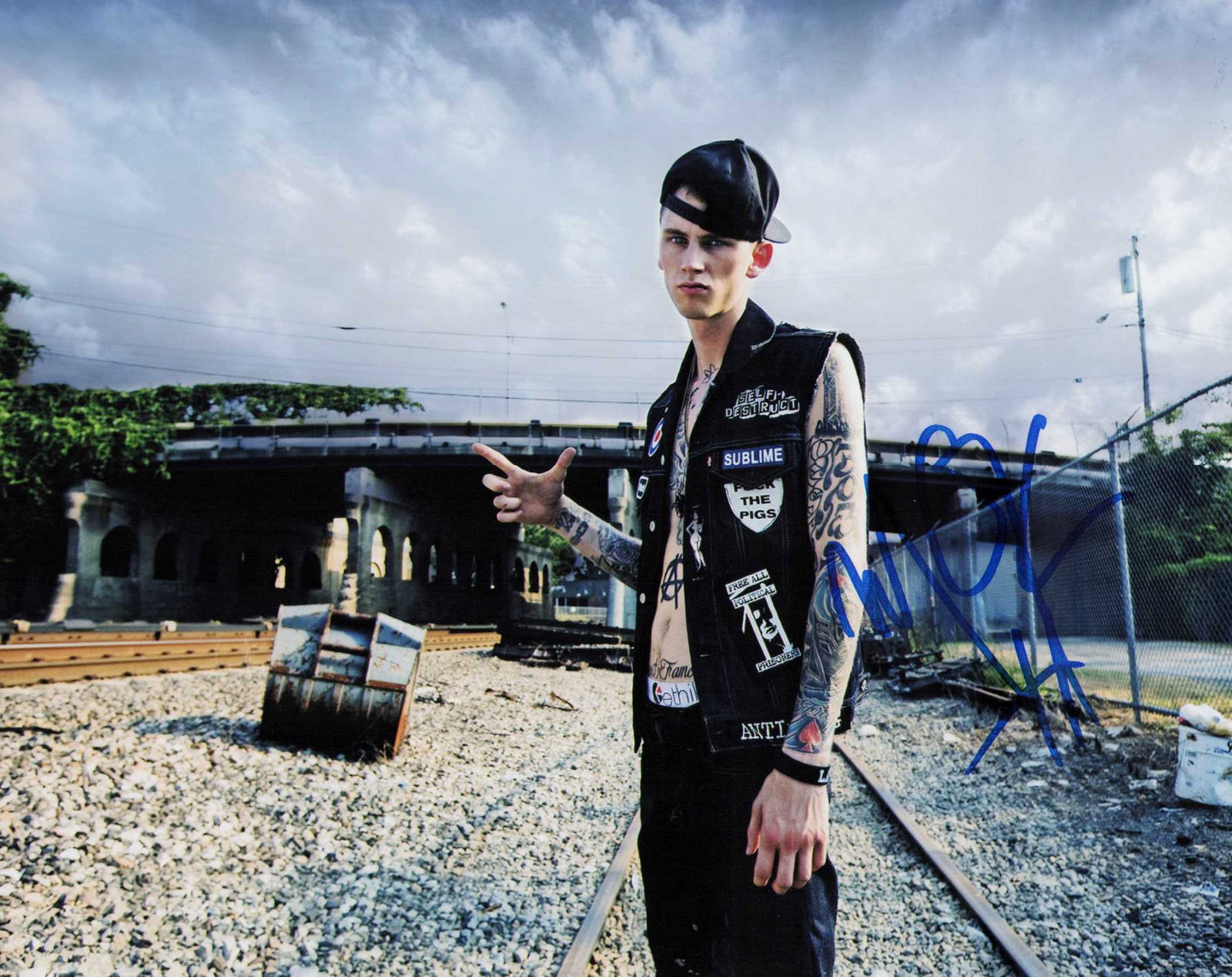 Machine Gun Kelly signed photograph: Rare signed 8x10 of the singer Certificate of AuthenticityEVERY item in this auction comes with at minimum one fully illustrated and serial numbered searchable online COA signed by the leading