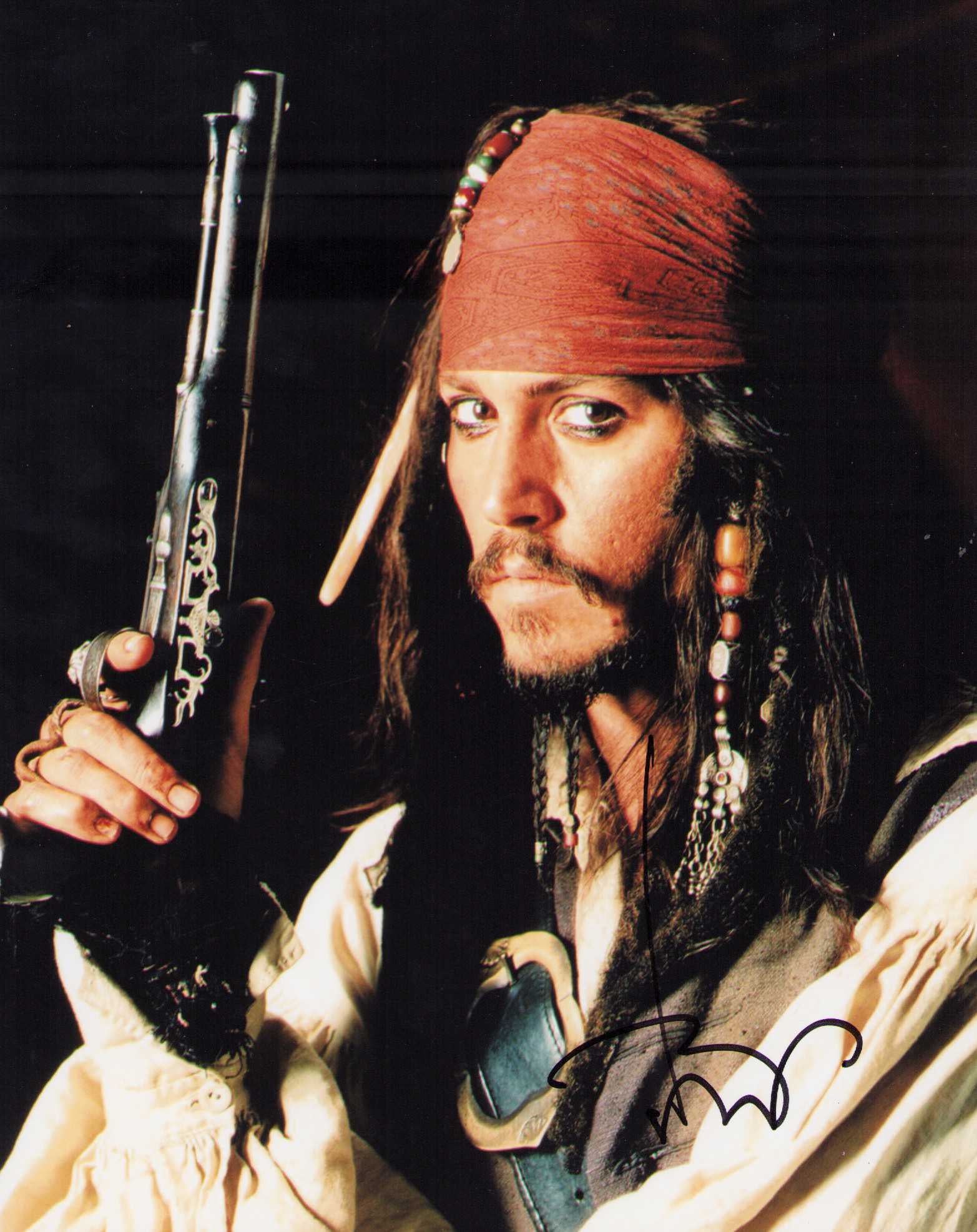 Johnny Depp Pirates signed photograph: A signed Pirates 8x10 by Depp classic ! Certificate of AuthenticityEVERY item in this auction comes with at minimum one fully illustrated and serial numbered searchable online COA signed by the