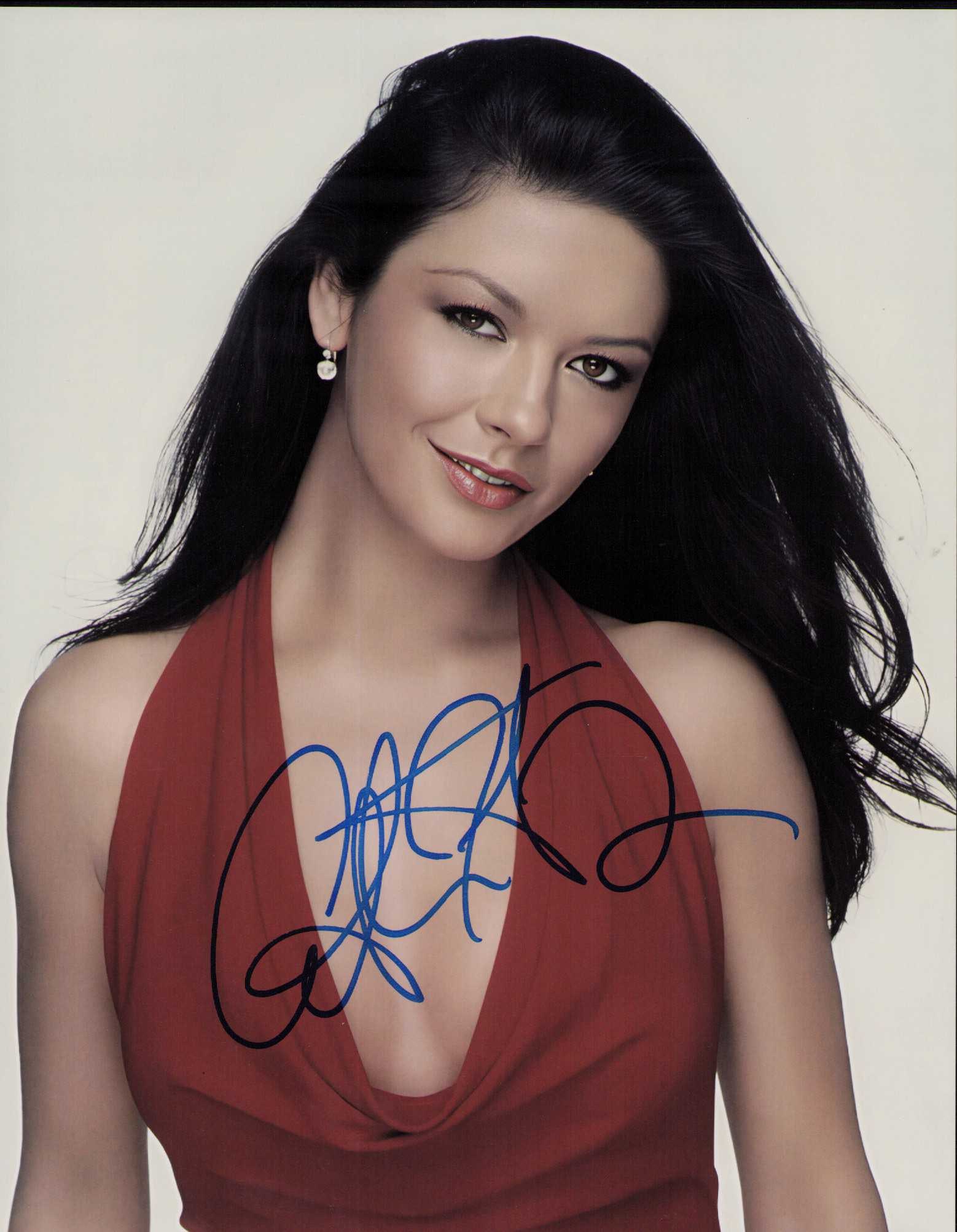 Catherine Zeta Jones signed photo: A sexy vintage signed 8x10 of the scarce signing actress Certificate of AuthenticityEVERY item in this auction comes with at min one fully illustrated and serial numbered , searchable online COA signe