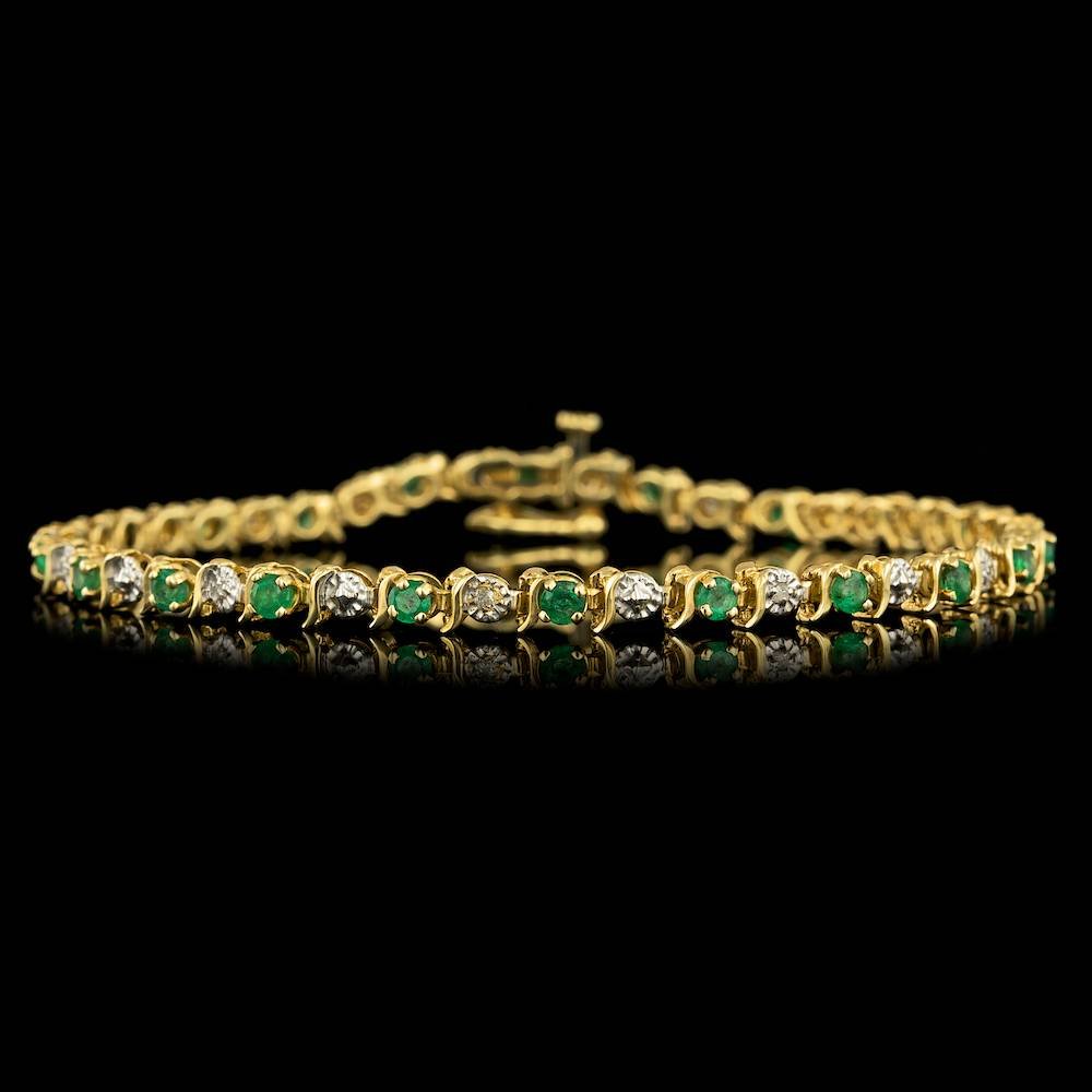 14k Gold 2.20ct Emerald 0.05ct Diamond Bracelet: Retail: $2,300.00 This elegant ladies bracelet is crafted in solid 14k Yellow Gold and features 22 (2.20 ctw) 100% Natural Emeralds mined from Colombia + accented with 11 sparkling eye-clean natural D