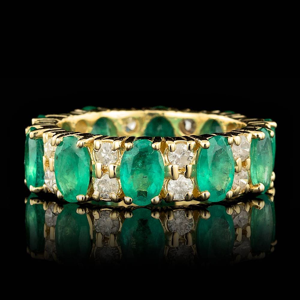 14k Gold 4.00ct Emerald 1.10ct Diamond Ring: BHGL Certified: $4,300.00 This magnificent ladies ring is crafted in solid 14k Yellow Gold and features 10 (4.00 ctw) 100% Natural Emeralds mined from Colombia + accented with 20 sparkling eye-clean n