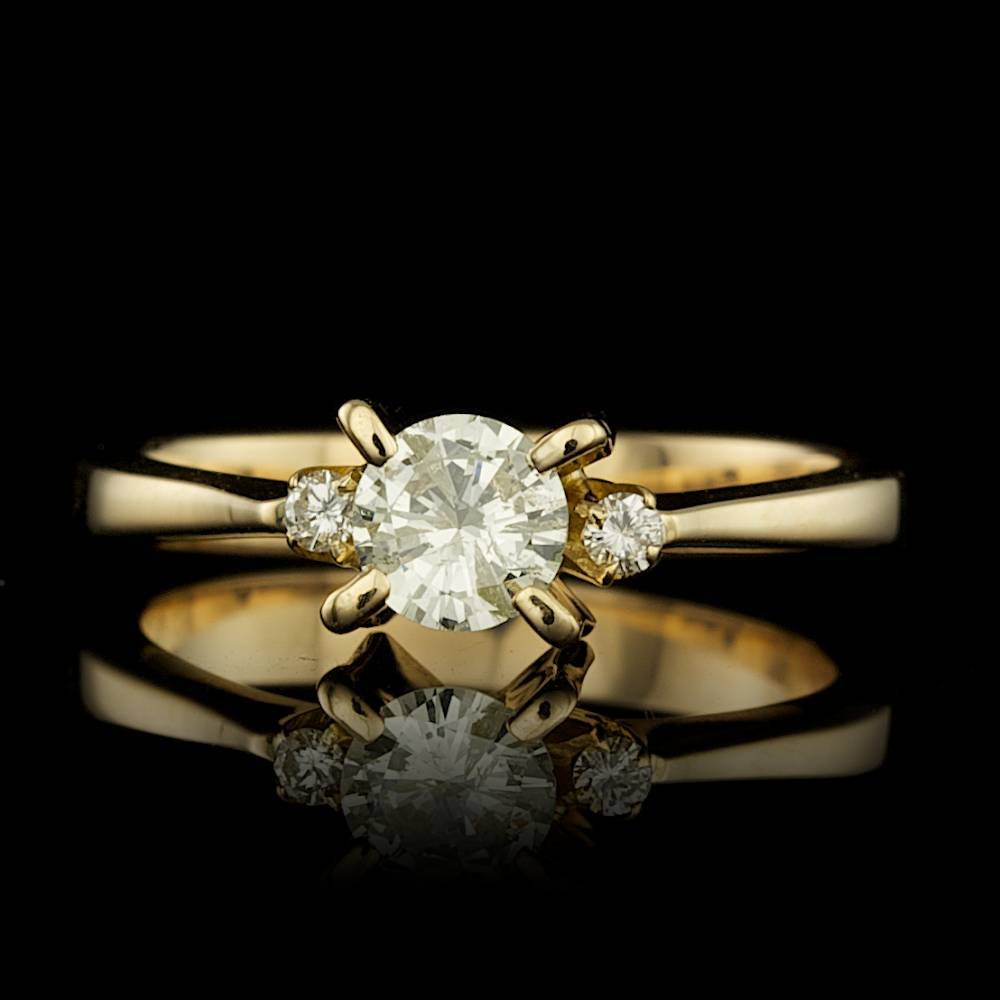 14k Yellow Gold .5ct Diamond Ring: BHGL Certified: $1,900.00 This lovely ladies ring is crafted in solid 14k Yellow Gold and features a 0.45 carat 100% Natural Diamond accented with 2 sparkling eye-clean natural Diamonds, totaling 0.05