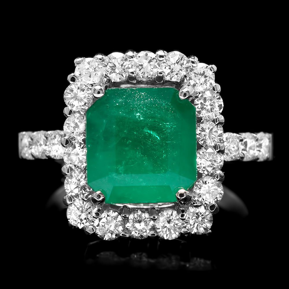 14k White Gold 3.00ct Emerald 1.10ct Diamond Ring: BHGL Certified: $10,800.00 This magnificent ladies ring is crafted in solid 14k White Gold and features a 3.00 carat 100% Natural Emerald mined from Colombia + accented with 24 sparkling eye-clean nat