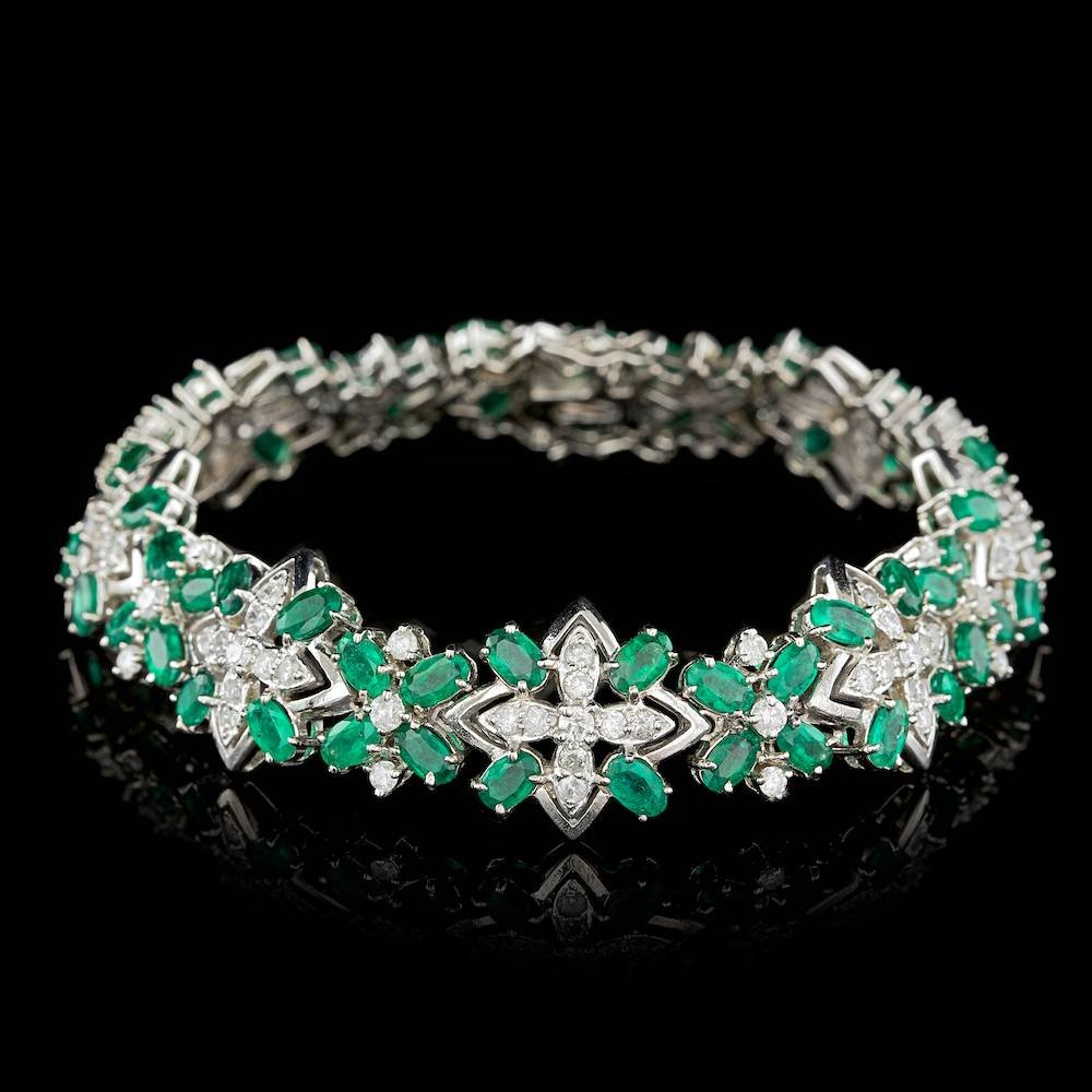 14k Gold 15.00ct Emerald 3.60ct Diamond Bracelet: BHGL Certified: $38,700.00 This luxurious ladies bracelet is crafted in solid 14k White Gold and features 64 (15.00 ctw) 100% Natural Emeralds mined from Colombia + accented with 96 sparkling eye-clea