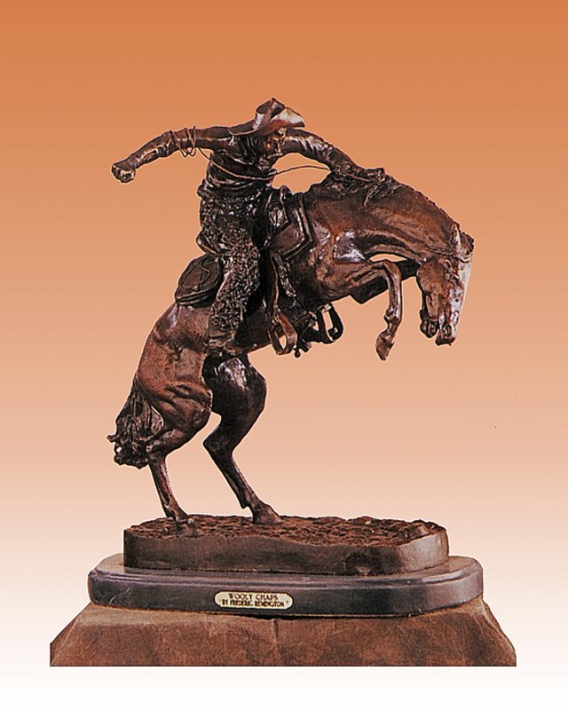 Frederic Remington -Whooly Chaps Bronze Sculpture: Whooly Chaps- Frederic Remington. Size 22x17. This is a bronze sculpture in the lost wax method and has a beautiful patina and is mounted on a fine Italian marble base.