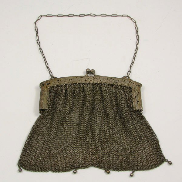 Antique Silver Mesh Handbag w/ Open Floral Frame : Antique silver (not marked) mesh handbag with open or reticulated floral decoration to the frame. Loss of one bead on bottom and few holes to mesh. Bag is 7 3/4" wide by 6 3/8" high not including chai