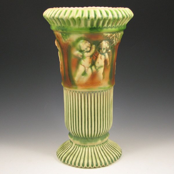 Roseville Donatello 113-12" Vase : Roseville Donatello vase with dancing cherubs. Marked with a faint Roseville Donatello circular mark and 113 in blue ink. Upper half of the vase has been restored. 11 3/4" tall by 6 3/4" wide.