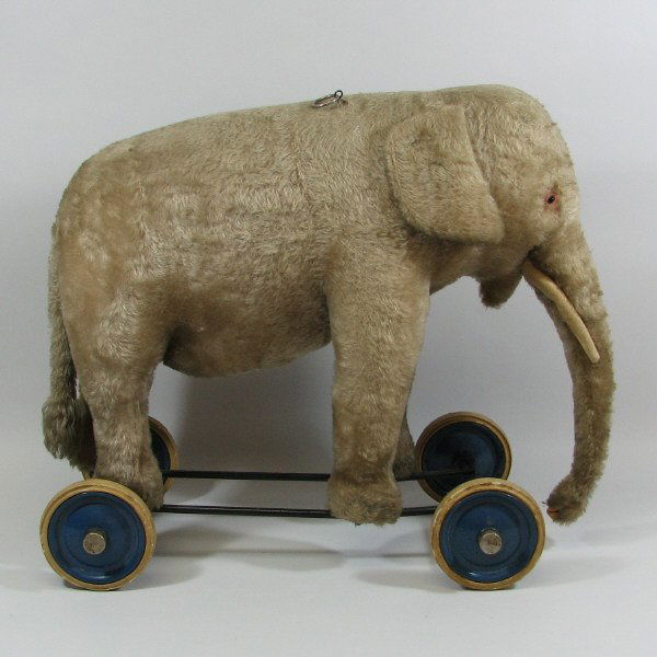 1910 stuffed elephant on wheels