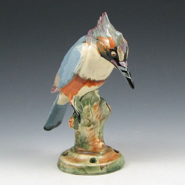 Weller Brighton Kingfisher Figure: Weller Brighton Kingfisher figure on a flower frog base in high glaze. Marked Weller in block letters. The very tip of his crest has been touched up. 8 1/2" tall.