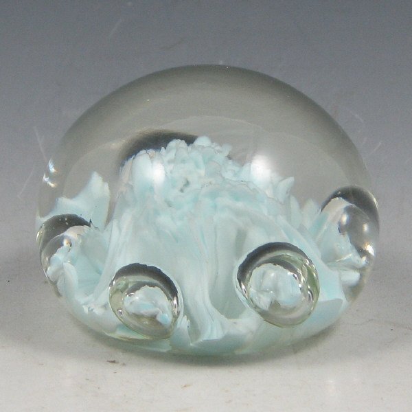 St. Clair (Maude and Bob) 1975 Paperweight: Maude and Bob St. Clair paperweight from 1975 with very light blue interior design. Marked with impressed circular mark. Excellent condition. 2 3/8" wide by 1 5/8" tall.