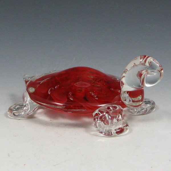 St. Clair (Maude and Bob) 1979 Turtle Paperweight: Maude and Bob St. Clair turtle paperweight with red interior from 1979. Marked with impressed circular mark. Excellent condition. 5 1/4" wide by 2" tall.