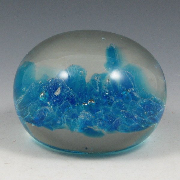 St. Clair (Maude and Bob) 1974 Paperweight: Maude and Bob St. Clair blue paperweight. The date is partially blurred, but appears to be 1974. Marked with impressed circular mark. Excellent condition. 3 1/2" wide by 2 3/8" tall.