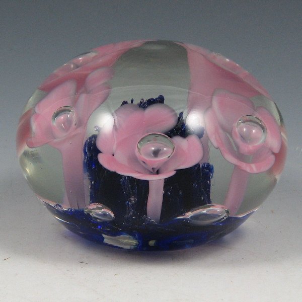 St. Clair (Maude and Bob) 1971 Floral Paperweight: Maude and Bob St. Clair floriform paperweight from 1971 in pink and cobalt blue. Marked with impressed circular mark. Couple of small bruises to the piece. 3 7/8" wide by 2 5/8" tall.