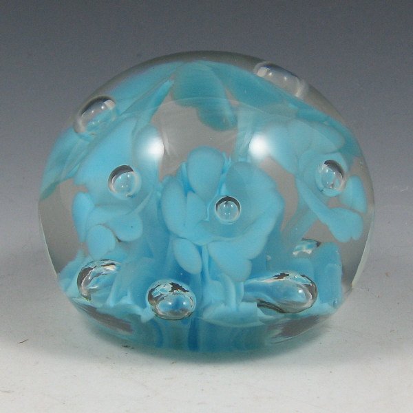 St. Clair (Maude and Bob) 1974 Floral Paperweight: Maude and Bob St. Clair floriform paperweight from 1974 with light blue design. Marked with impressed circular mark. Excellent condition. 3 1/2" wide by 2 3/4" tall.