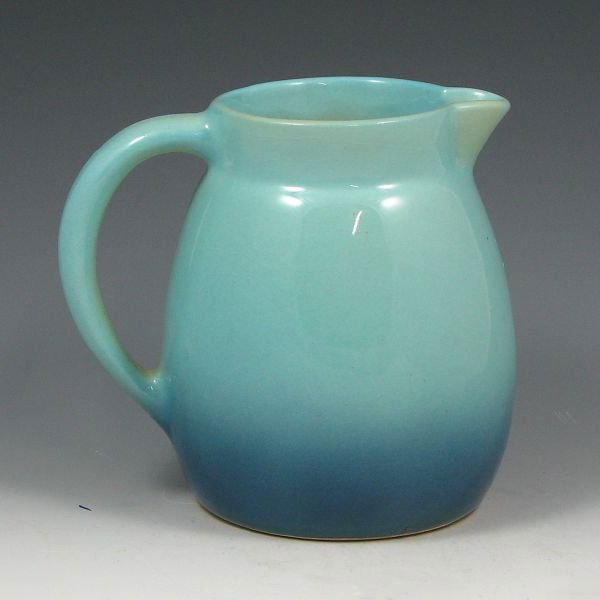 Roseville Raymor or Utility Ware Pitchers - Mint: Two (2) Roseville Raymor or Utility ware pitchers. Both marked R 15 USA. Both mint. 5 1/2" tall.