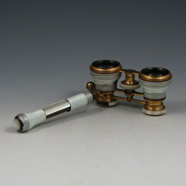 Tiffany & Co. Mother Of Pearl Opera Glasses: Tiffany & Co. mother of pearl opera glasses with enameled gold filigree decoration. Marked Tiffany & Co. There are four strips of MOP missing from the handle and three segments missing from around one