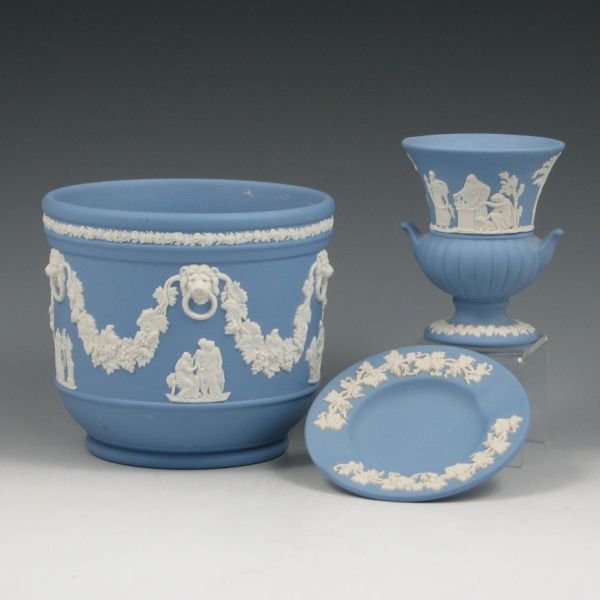 Wedgwood Jardiniere, Vase & Ashtray - Excellent: Three pieces of light blue Wedgwood jasper ware including a jardiniere, a vase and an ashtray. All are marked WEDGWOOD MADE IN ENGLAND along with various letters and numbers. The jardiniere is marked 
