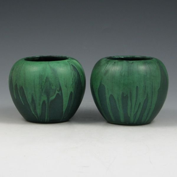 Peters & Reed Matte Green Shadow Ware Vases: Two (2) Peters & Reed matte green Shadow Ware ball vases. One is marked with Zane Ware mark, other is very faintly marked with the same. Each has a glaze flake to the rim. One has a 2 1/2" hairline de