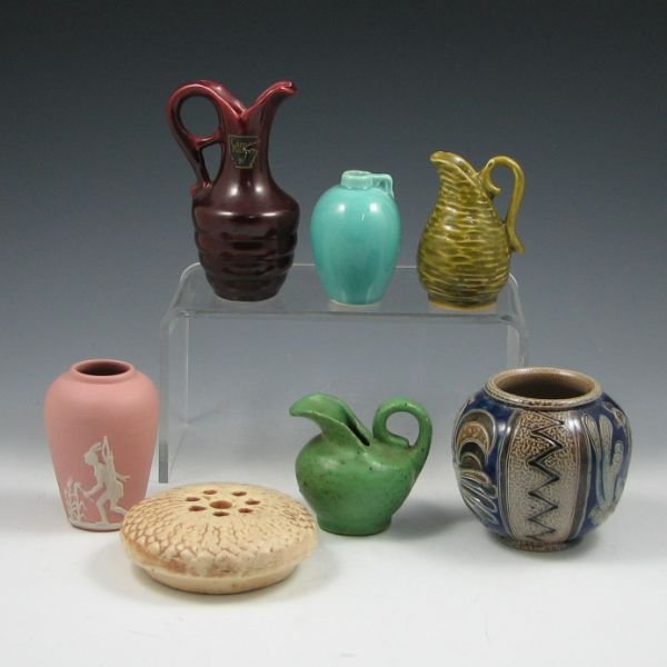 Six Pottery Cabinet Pieces - Camark, Others: Six piece of 2 3/4" to 4 3/4" cabinet pottery including vases and jugs. Notably, a red Camark ewer with label and nice Indian and settler bisque vase are included. Also included is a flower frog. This