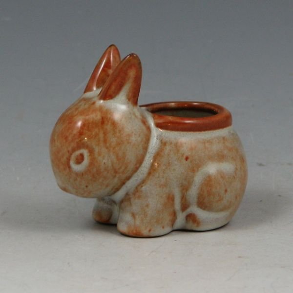 Nicodemus #134 Bunny Planter - Mint w/ Label: Nicodemus #134 bunny planter. Marked with Nicodemus semi-circular impressed stamp, EJ for Ellen Jennings and with original Ferro-Stone label. Mint. 2 1/4" long by 2" tall.