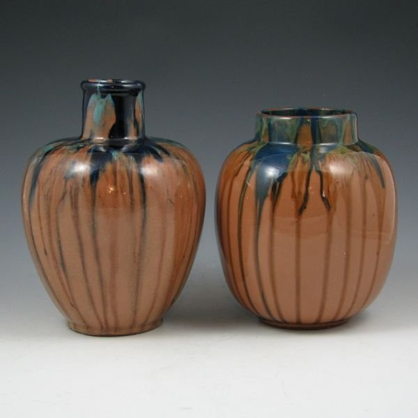 Peters & Reed Shadow Ware Vases (2) - Excellent: Two Peters & Reed Shadow Ware vases in blue over brown. Both marked with partial Zane Ware stamps. Some glaze abrasions, but overall excellent condition. 7 1/4" and 6 1/4" tall.