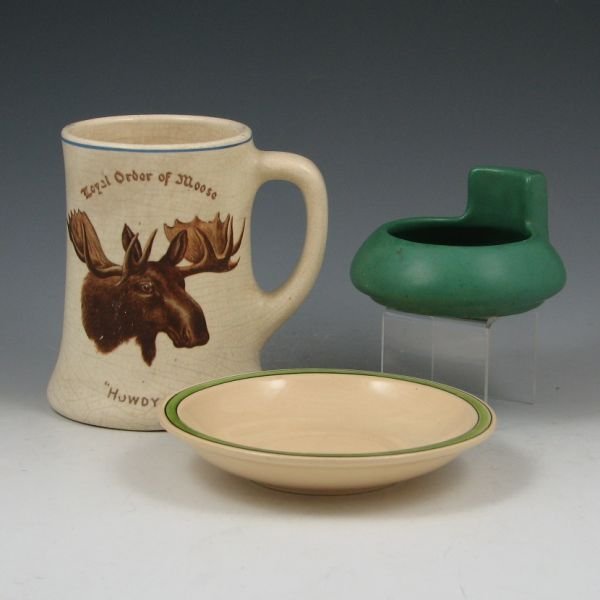 Roseville Juvenile, Matte Green, Creamware Lot: Lot of three early 20th Century pieces of Roseville including a 5 1/4" Juvenile underplate (excellent), 4 3/4" Creamware Royal Order of Moose "Howdy Pap" mug (crazed, flake to rim) and a Matte Green 3