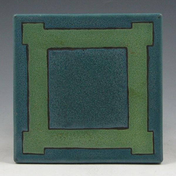 Saturday Evening Girls (SEG) 1913 Trivet: Saturday Evening Girls (SEG) three-color trivet from 1913. Marked SEG 6-2-13 with artist's mark. There is a chip to the bottom corner of one of the feet. 5 1/4" square.