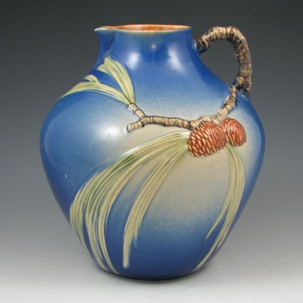 Roseville Pine Cone 708-9" Pitcher - Mint: Roseville Pine Cone broad pitcher in blue. Marked Roseville 708-9. Mint. 9 1/4" tall by 8 1/2" wide.