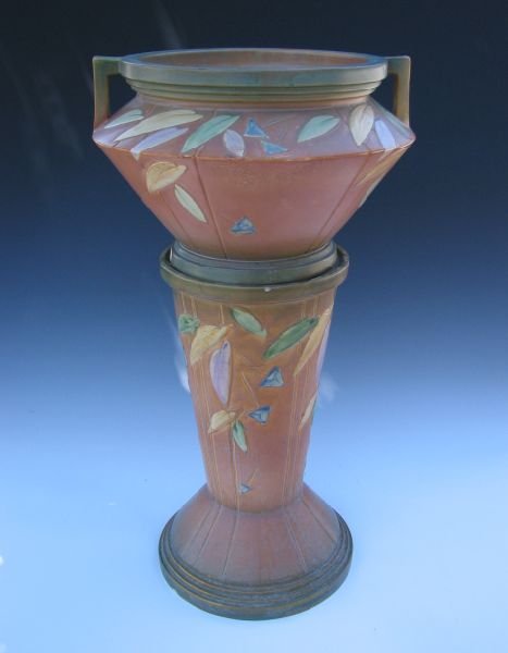 Roseville Futura 616-10" Jardiniere & Pedestal: Roseville Futura 616-10" jardiniere and pedestal. Unmarked. Chips to both pieces, two tight hairlines to the base of the pedestal. Overall height of 28".Provenance: Collection Museo de Arte de Ponce,