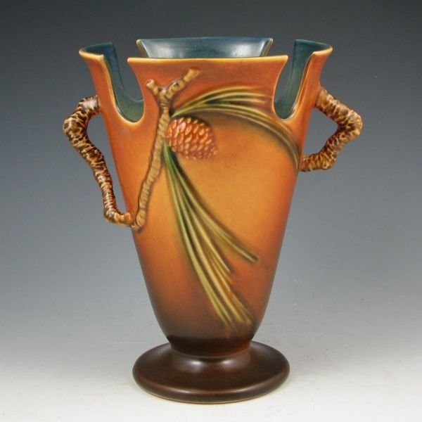 Roseville Pine Cone 843-8" Vase - Mint: Roseville Pine Cone vase in brown with cut-away rim. Marked Roseville 843-8". Mint. 8 3/8" tall by 7 1/2" wide.