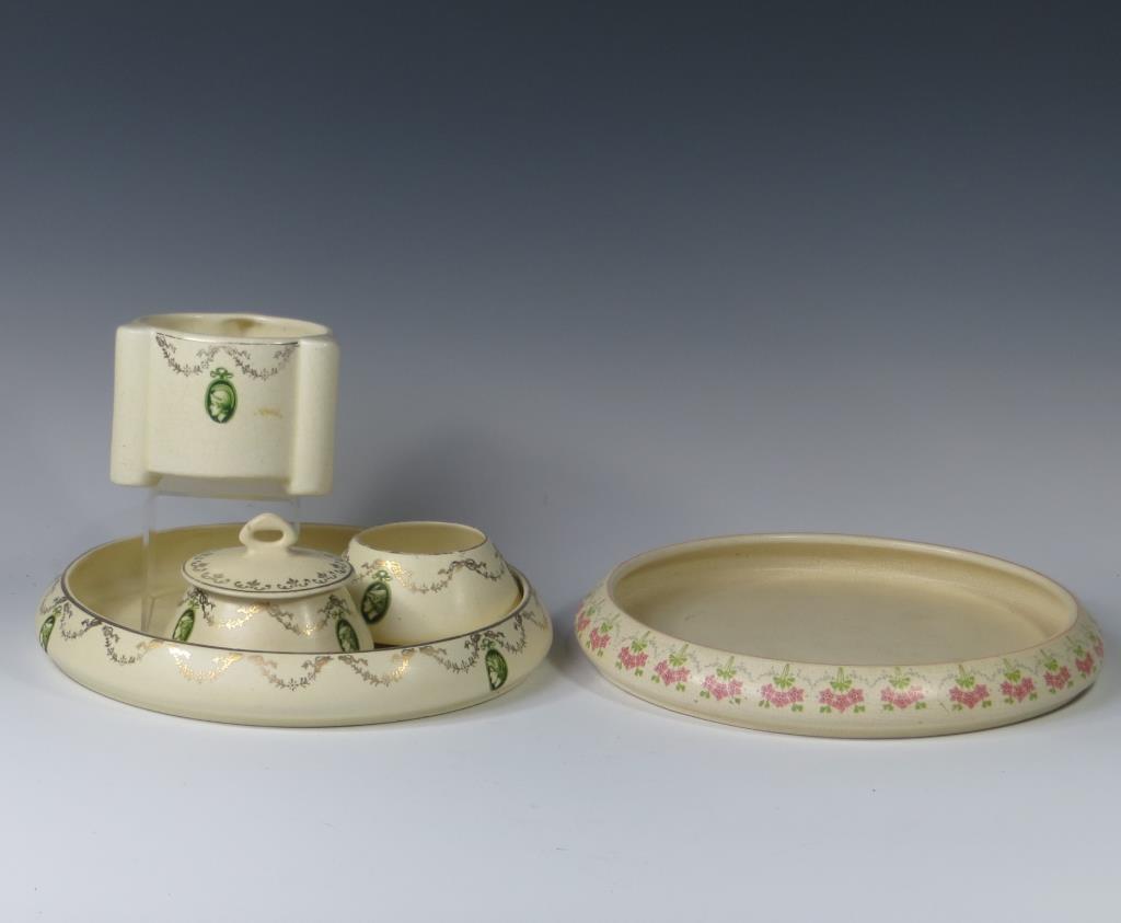Roseville Creamware Group Lot: Roseville Creamware Group Lot including medallion dresser set and extra under plate. Five pieces total. Unmarked. Typical use condition including hairline to the receiver.